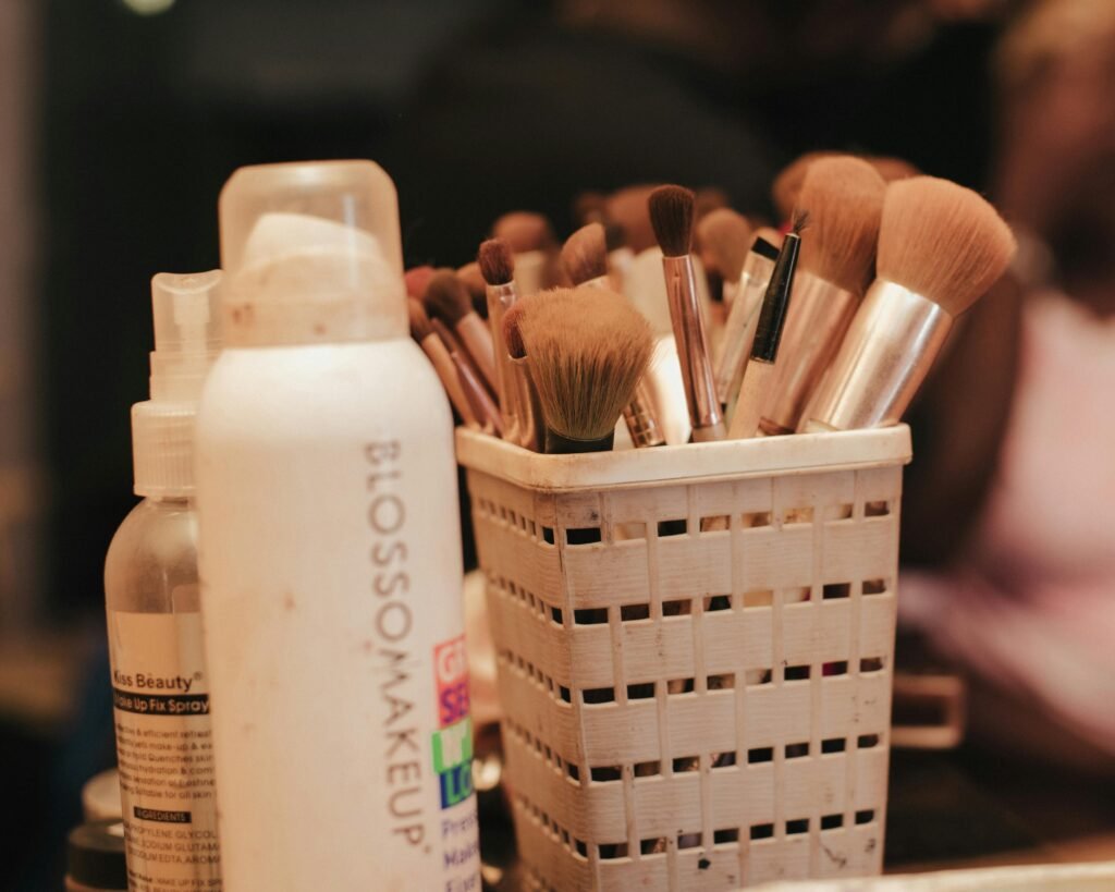 Bridal Hair and Makeup A collection of makeup brushes and beauty products neatly organized in a holder.